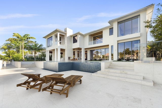 rear view of house featuring a patio area