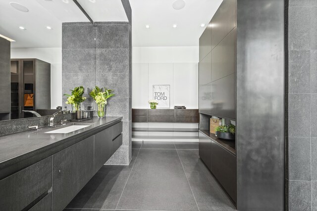 bathroom featuring plus walk in shower, plenty of natural light, and vanity