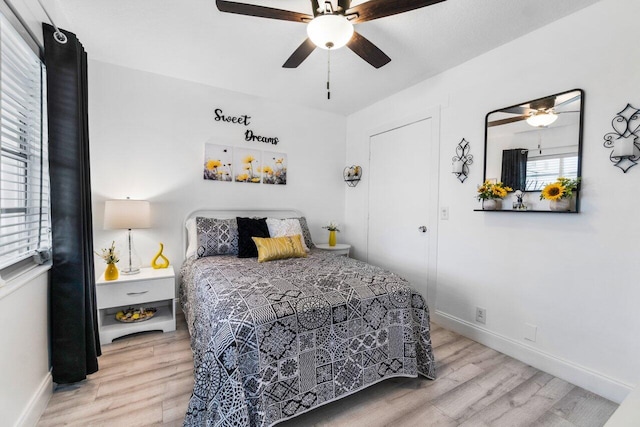 bedroom featuring wood-type flooring and ceiling fan