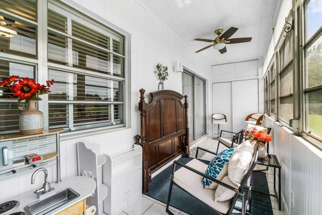 sunroom featuring sink and ceiling fan