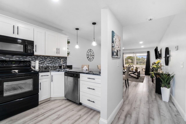 kitchen featuring white cabinets, tasteful backsplash, light hardwood / wood-style floors, and black appliances