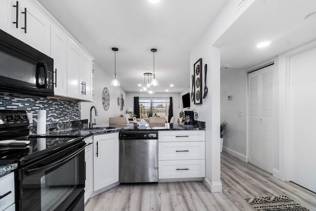 kitchen featuring sink, tasteful backsplash, light wood-type flooring, white cabinetry, and black appliances