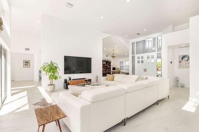 living room featuring high vaulted ceiling