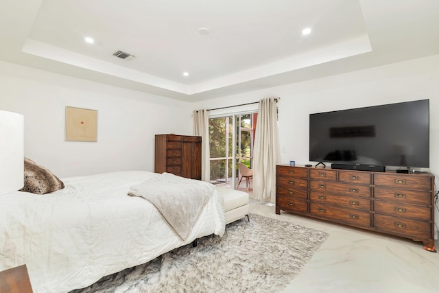 bedroom with a tray ceiling