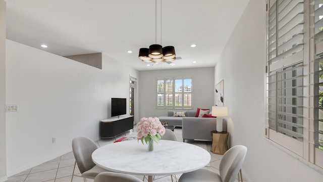 dining space featuring light tile floors