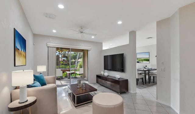 living room with ceiling fan and light tile floors