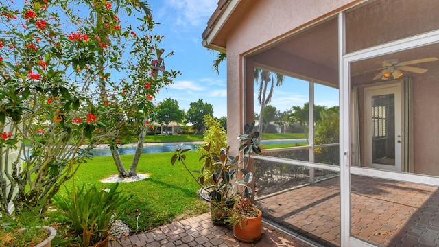 view of yard featuring a patio area and a water view