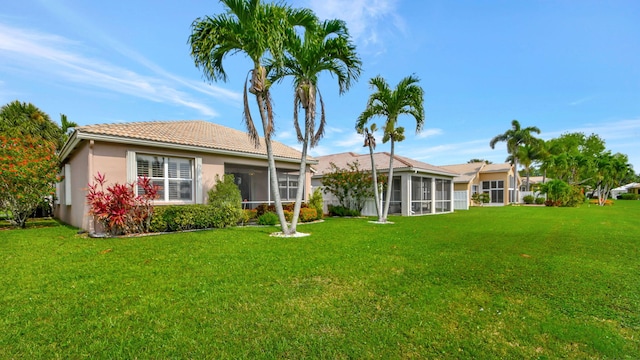 view of yard with a sunroom