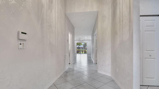 corridor with light tile floors