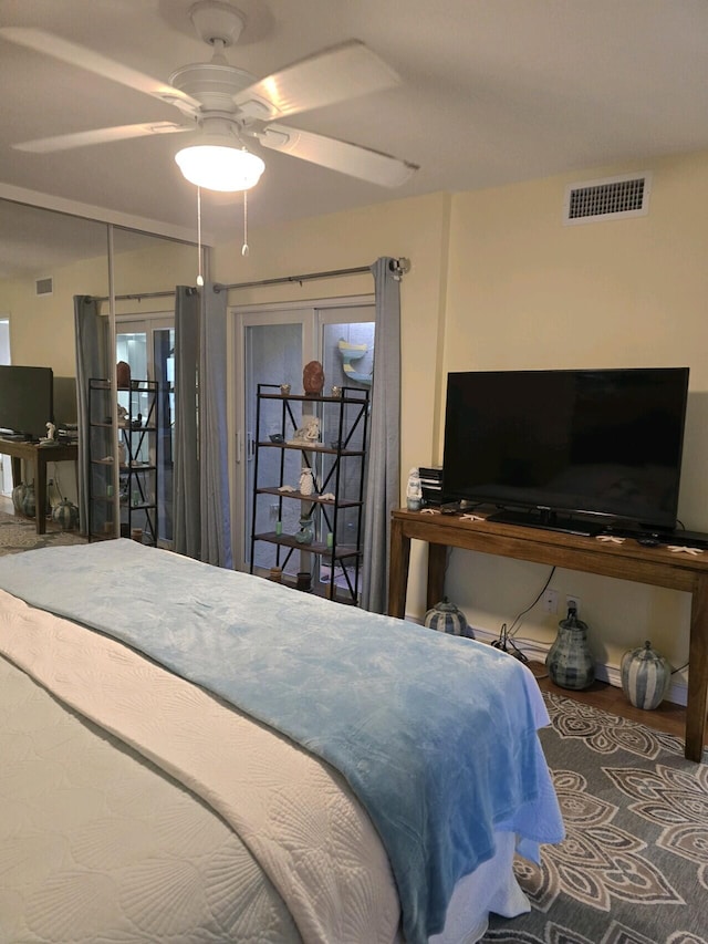 bedroom with ceiling fan, access to outside, and french doors