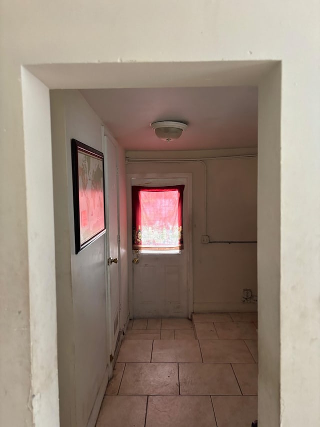 hallway with light tile patterned floors