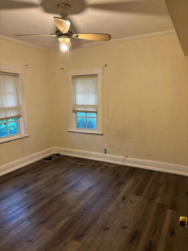 unfurnished room featuring ceiling fan, dark wood-type flooring, and a healthy amount of sunlight