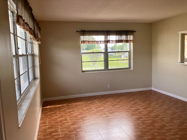 empty room with a textured ceiling