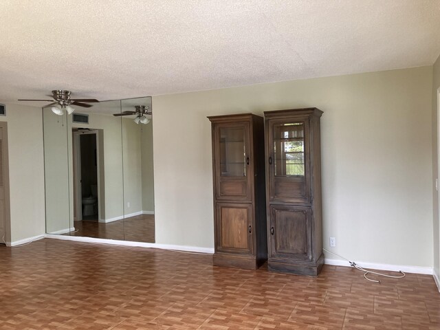 226 Camden J, West Palm Beach, FL 33417 - empty room with a textured ceiling, baseboards, and a ceiling fan