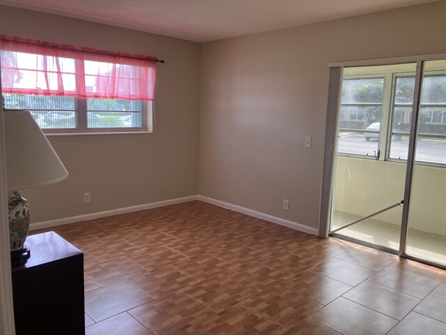 226 Camden J, West Palm Beach, FL 33417 - spare room with baseboards