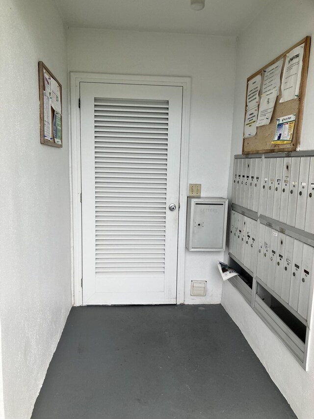 226 Camden J, West Palm Beach, FL 33417 - entryway with mail area and concrete floors