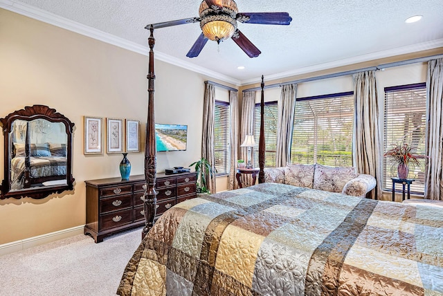 carpeted bedroom with ornamental molding, ceiling fan, and a textured ceiling