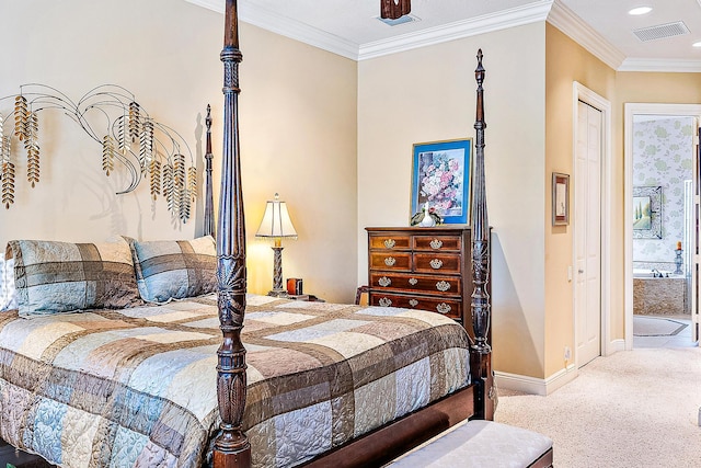 carpeted bedroom featuring ensuite bath, ceiling fan, and ornamental molding