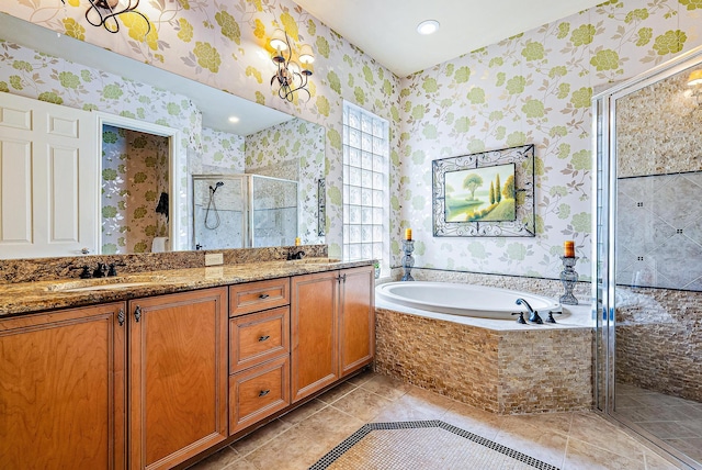 bathroom featuring tile floors, separate shower and tub, and dual vanity