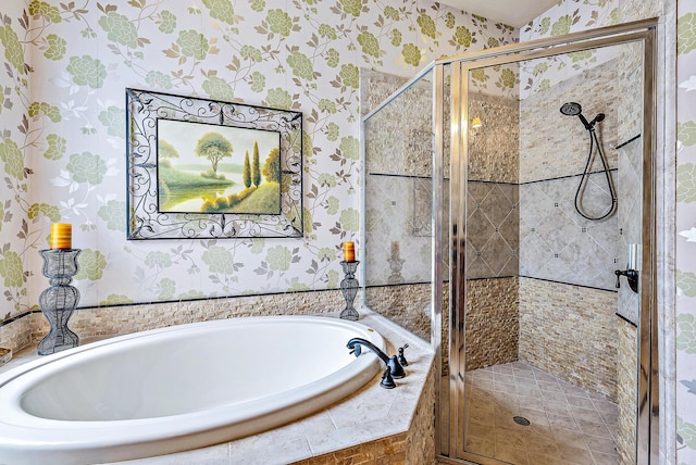 bathroom featuring separate shower and tub