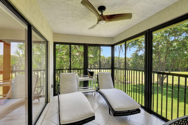 sunroom / solarium with plenty of natural light and ceiling fan