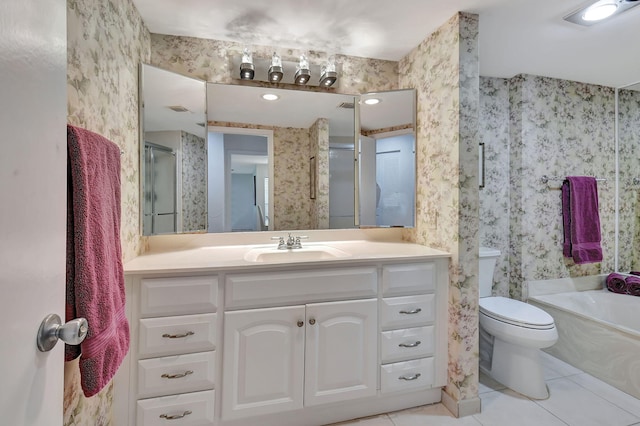 full bathroom with toilet, tile floors, vanity, and separate shower and tub