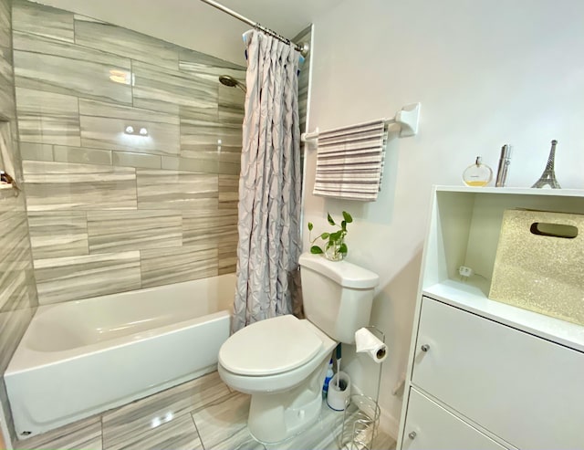 bathroom with shower / bathtub combination with curtain and toilet