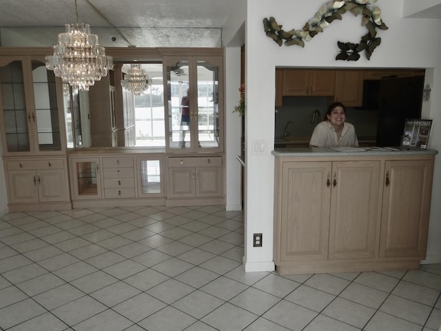 interior space featuring pendant lighting, an inviting chandelier, and light tile patterned flooring