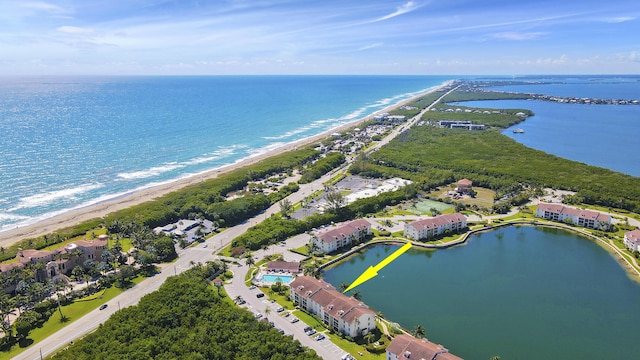 bird's eye view with a view of the beach and a water view