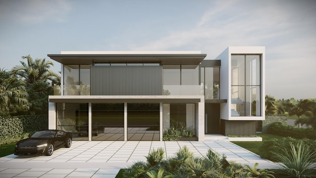 rear view of house with a patio area and stucco siding