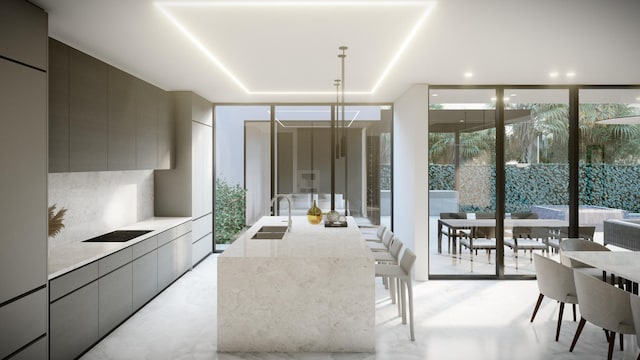 kitchen with gray cabinets, modern cabinets, a wall of windows, and a sink