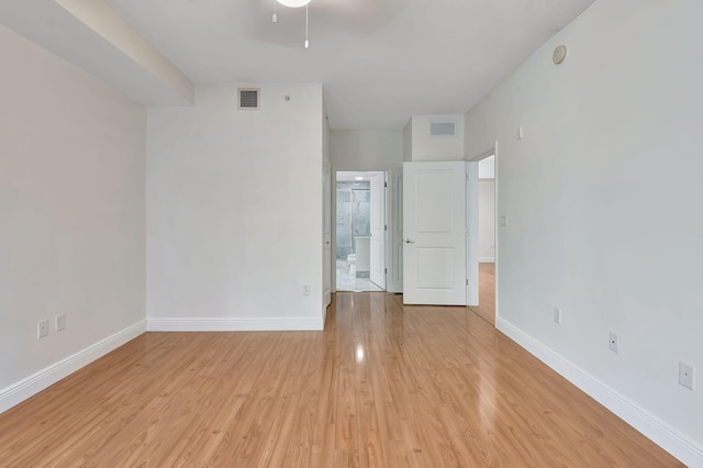 unfurnished room with ceiling fan and light wood-type flooring