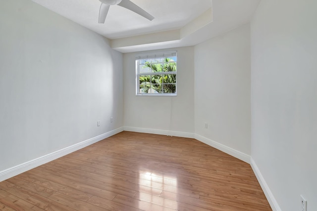 empty room with light hardwood / wood-style flooring and ceiling fan