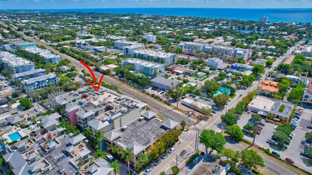 birds eye view of property featuring a water view