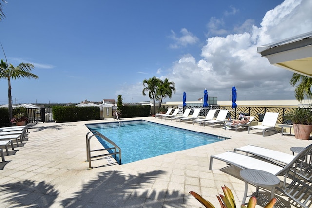 view of swimming pool featuring a patio area