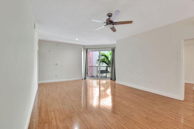 empty room with ceiling fan and light wood-type flooring