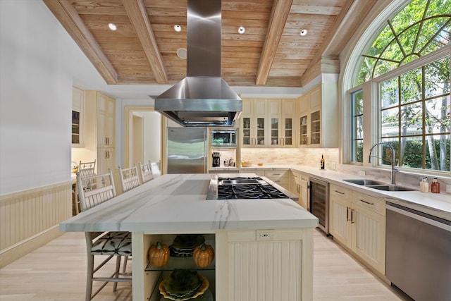 kitchen with wine cooler, stainless steel appliances, a kitchen island, and wooden ceiling