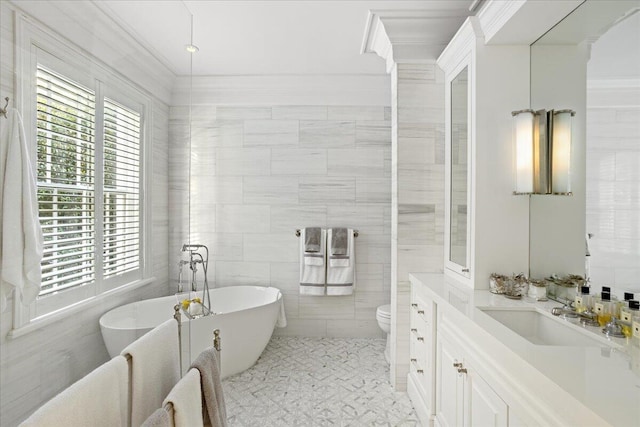 bathroom featuring a washtub, tile walls, and toilet