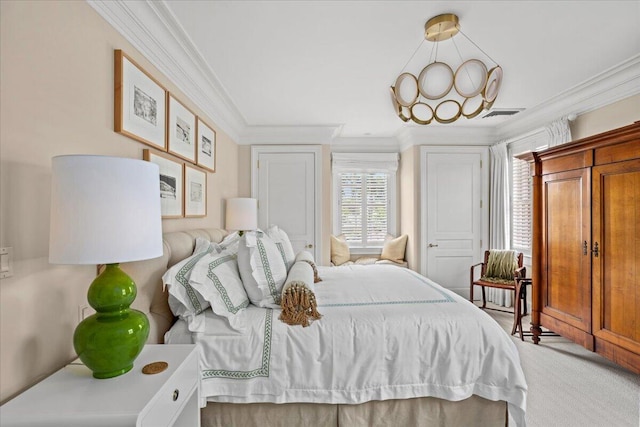 carpeted bedroom featuring crown molding