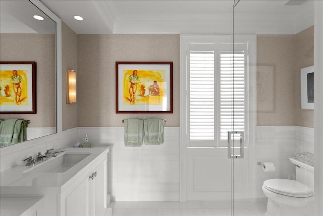 bathroom featuring vanity, toilet, and crown molding