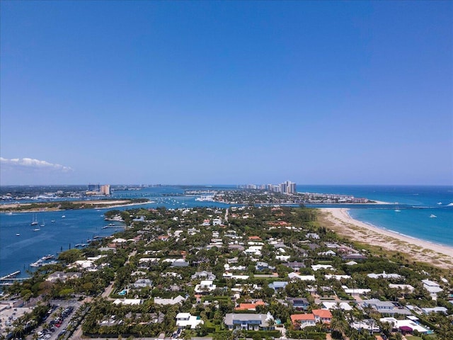 birds eye view of property featuring a water view and a view of the beach