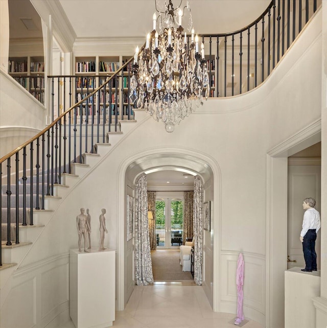 interior space with a high ceiling and ornamental molding