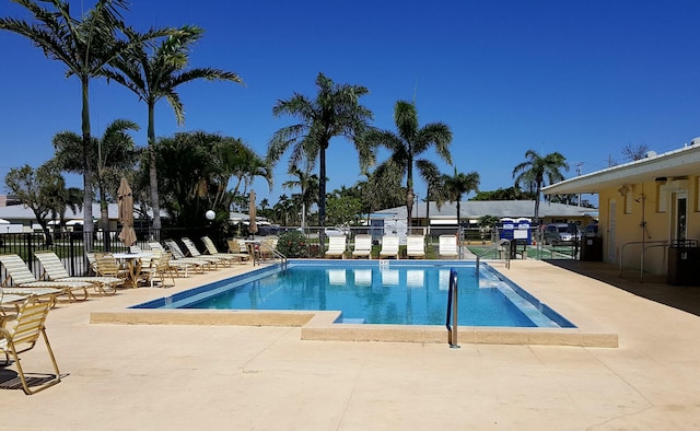 view of swimming pool with a patio