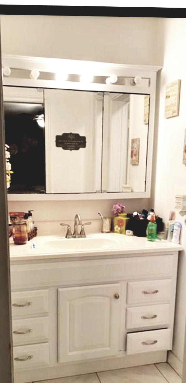 bathroom featuring vanity and tile floors