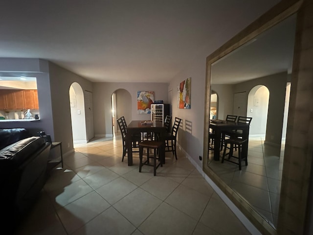 dining space featuring light tile patterned floors