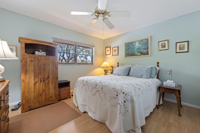 bedroom featuring ceiling fan and light hardwood / wood-style flooring