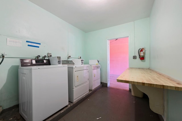 clothes washing area with washer hookup and washer and clothes dryer