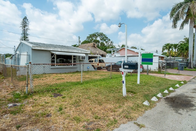 view of front of home featuring a front lawn