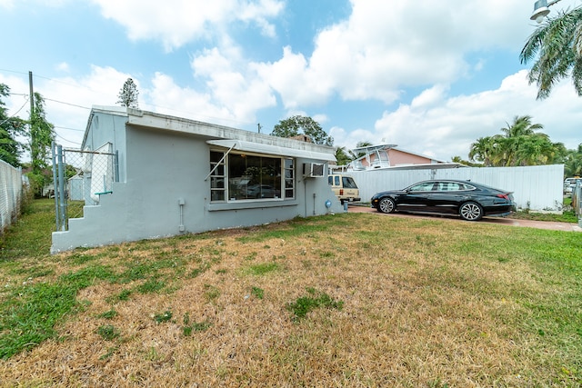 rear view of house with a lawn