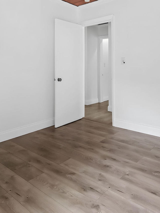 unfurnished room featuring hardwood / wood-style flooring